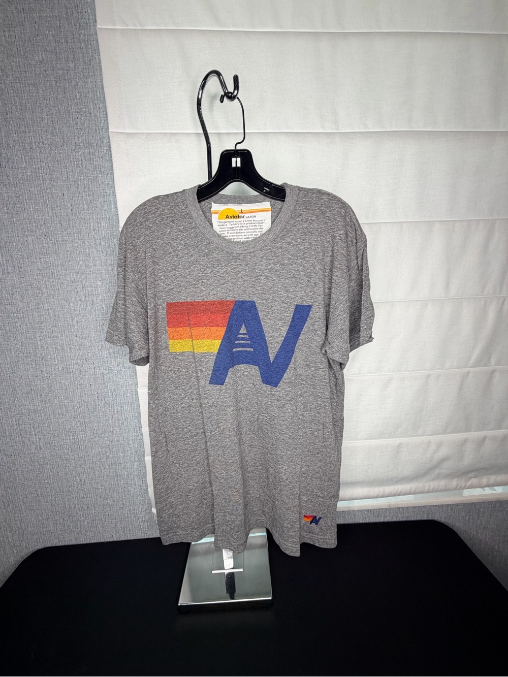 Aviator Nation Gray Tee with Blue 'AV' and Red-Orange-Yellow Stripes